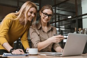 two ladies creating job descriptions