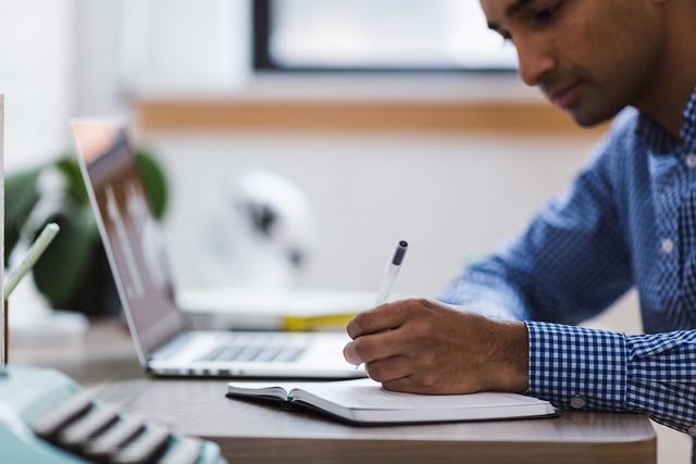 man writing list for exit planning