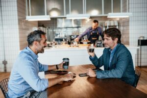 two businessman meeting at london cafe